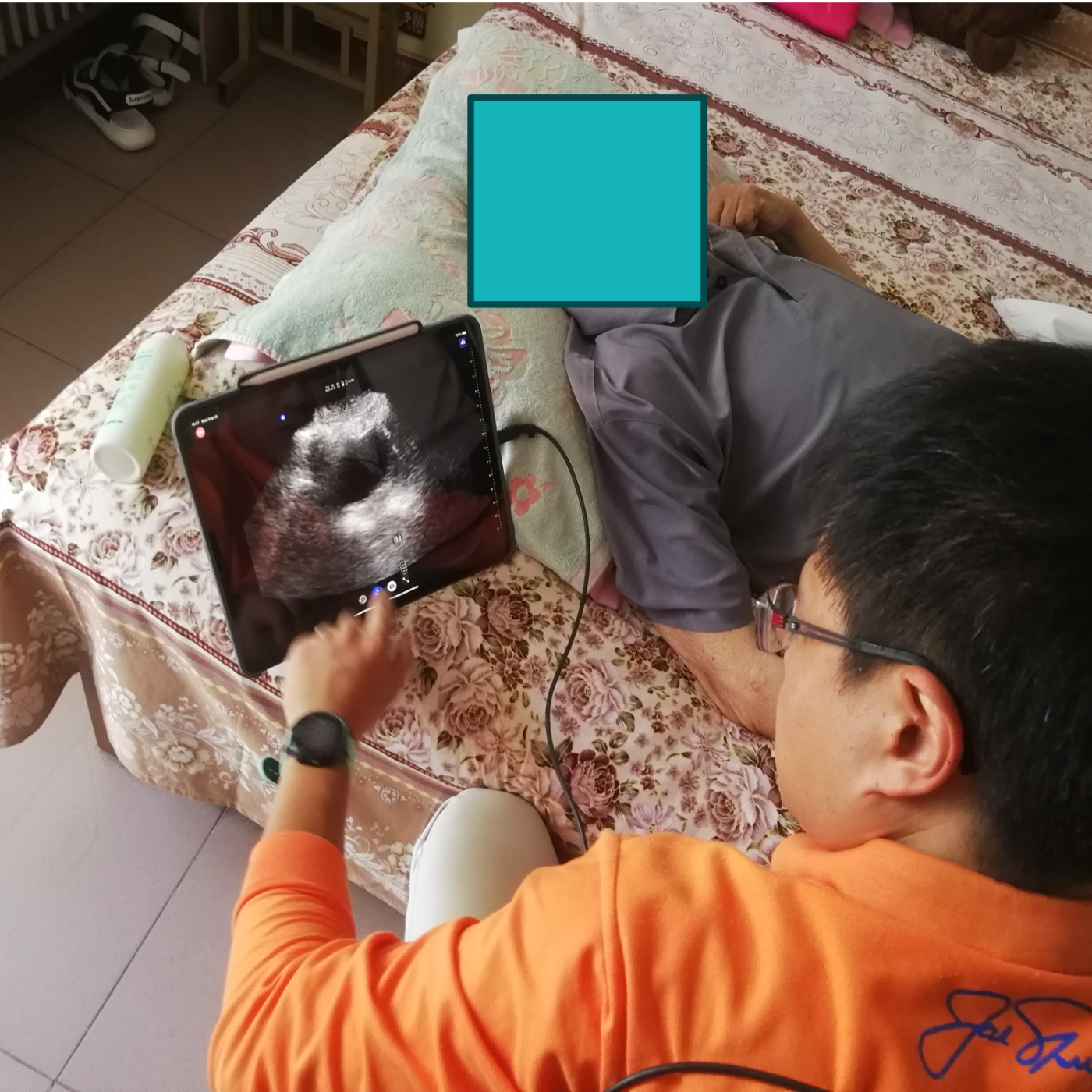 Healthcare professional performing an ultrasound examination on a patient.