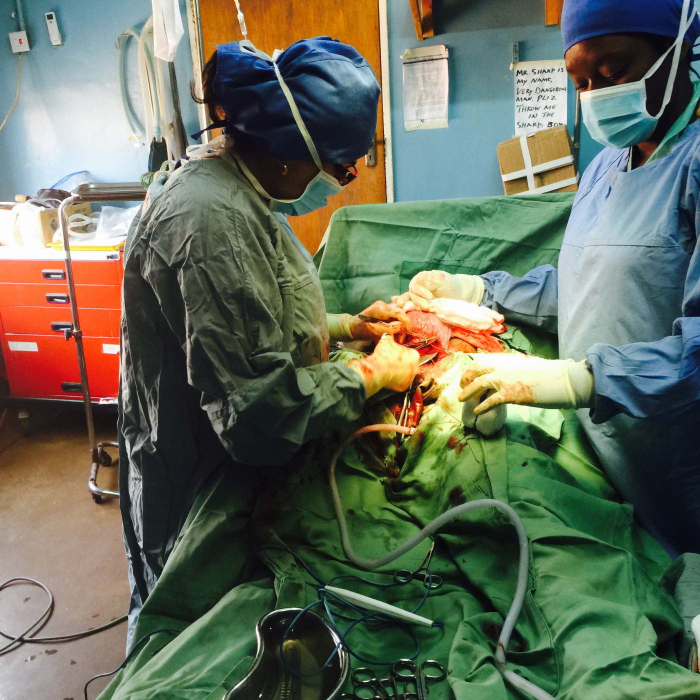 Healthcare professionals performing a surgical procedure.