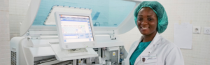 Laboratory professional working with diagnostic equipment in a hospital laboratory.
