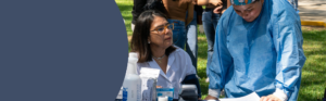 Healthcare professionals providing care and education during a community outreach event.