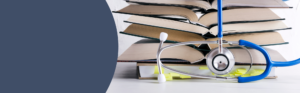 Medical reference books and a stethoscope representing graduate healthcare education.