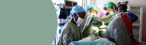 A group of healthcare professionals performing an operation.