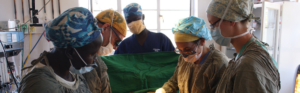 Multidisciplinary surgical team performing an operative procedure.