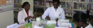 Pharmacy staff preparing and dispensing medications.