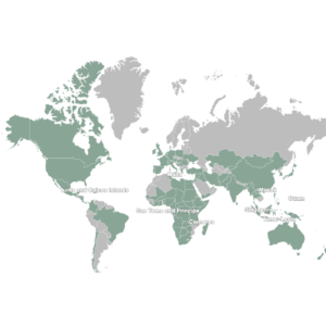 World map showing countries and territories represented by INMED learners and graduates across North America, South America, Europe, Africa, Asia, and Oceania. Small labeled countries and territories include Comoros, Guam, Macau, São Tomé and Príncipe, Singapore, Timor-Leste, Turks and Caicos Islands, and the U.S. Virgin Islands.