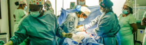 Surgical team performing a procedure in a resource-limited healthcare setting.