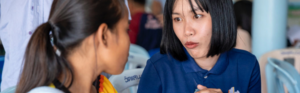 Healthcare provider reading educational materials in a healthcare setting.