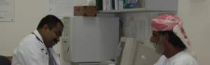 Healthcare provider conducting a patient consultation in an outpatient clinic.