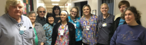 Healthcare professionals and learners gathered for a group photo during a healthcare training experience.