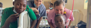 Healthcare learners interacting with pediatric patients during a hospital-based learning experience.